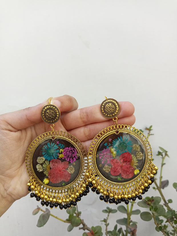 RESIN PRESERVED MULTI   FLOWER BLACK BASE  JHUMKA  EARRINGS