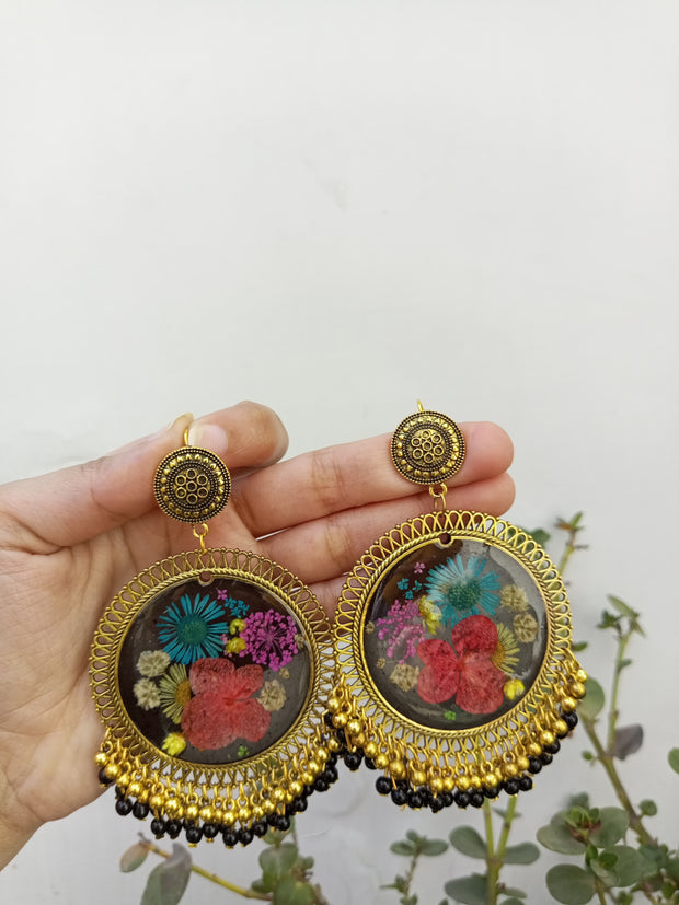RESIN PRESERVED MULTI   FLOWER BLACK BASE  JHUMKA  EARRINGS