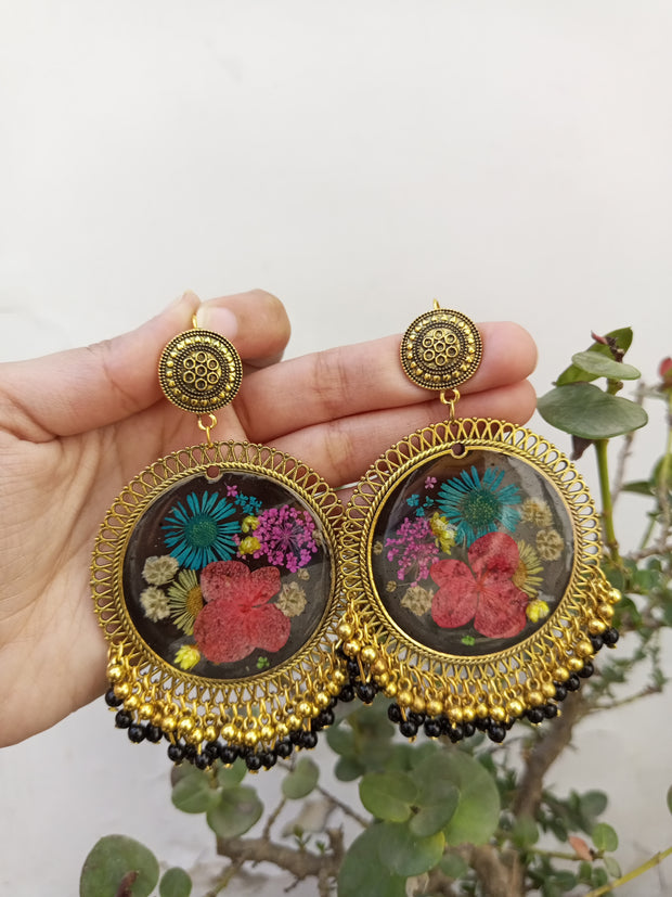 RESIN PRESERVED MULTI   FLOWER BLACK BASE  JHUMKA  EARRINGS