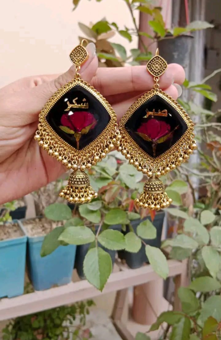 PRSERVE ROSE BUD IN BLACK BASE JHUMKA WRITE  " SABAR AND SHUKAR"