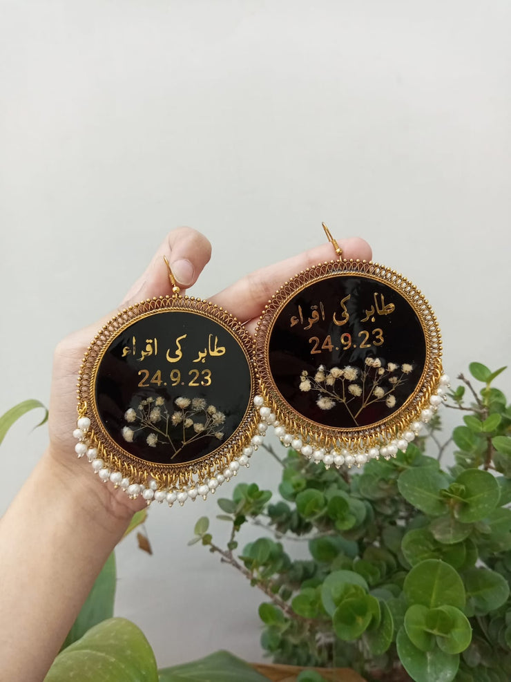 preserve white baby breath flower in oversize jhumka with date and " tahir ki iqra"