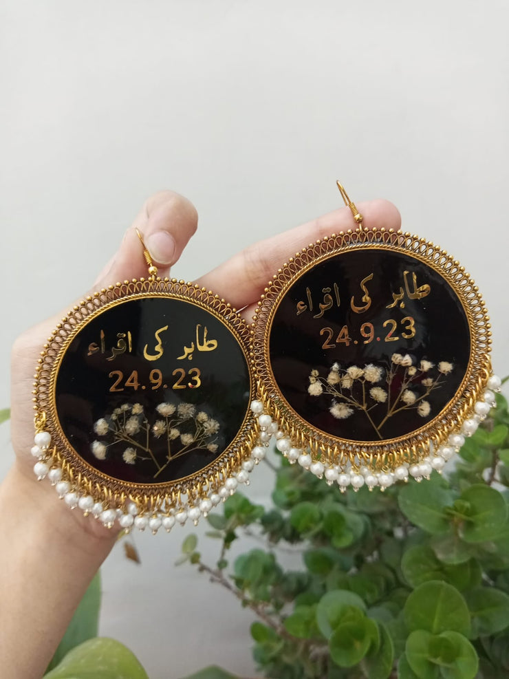 preserve white baby breath flower in oversize jhumka with date and " tahir ki iqra"