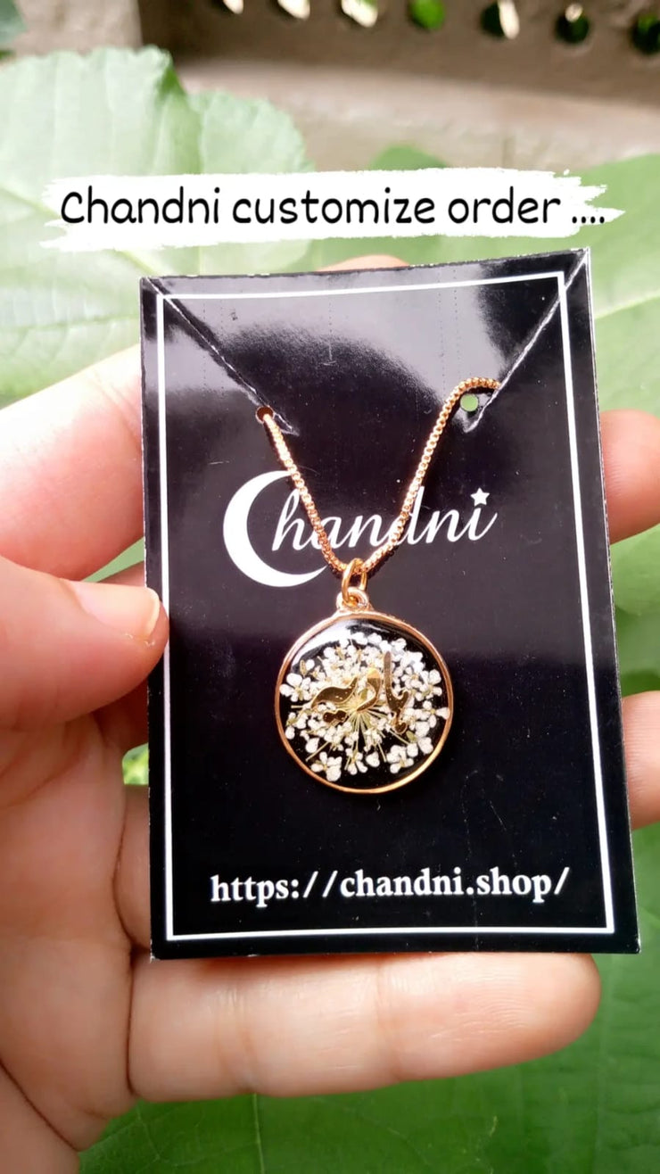 preserve flower in pendant with name " hadiya"