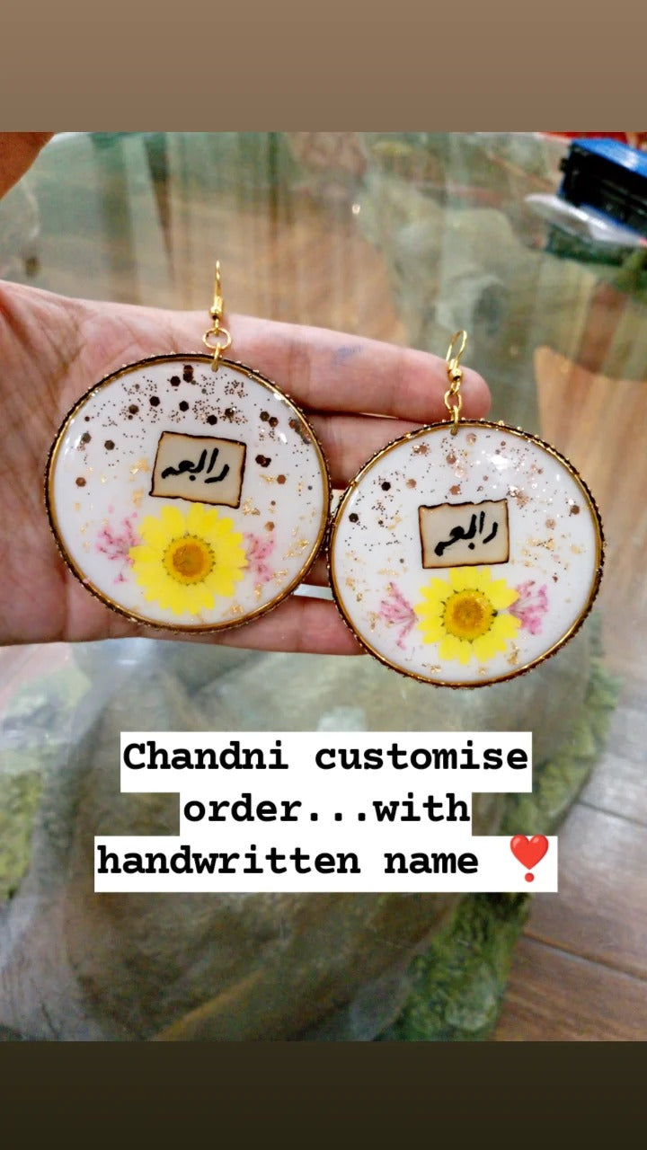 preserve flower in bangle earring with name " rabia"