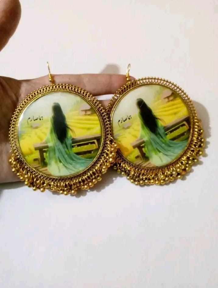 preserve painting in oversize jhumka with name "huma saram "